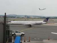 N13988 @ EWR - ERJ-145LR - by Christian Maurer