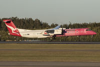 VH-QOH @ YBBN - QANTASLINK's Breast Cancer livery touching the right rear down as a crosswind blows her sideways - by V8Bathurst888