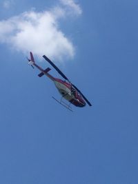 N63MB - Man hanging out the side taking photographs with telephoto lense. - by Andrew Howell