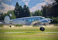N118SA @ E16 - Locally-based 1954 Beech E18S departing at the 2016 Airport Day at South County Airport, San Martin, CA. - by Chris Leipelt