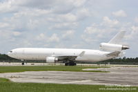 N415JN @ KRSW - McDonnell Douglas MD-11 (N415JN) sits on the ramp at Southwest Florida International Airport - by Donten Photography