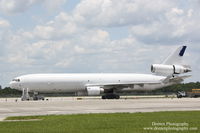 N412SN @ KRSW - McDonnell Douglas MD-11 (N412SN) sits on the ramp at Southwest Florida International Airport - by Donten Photography
