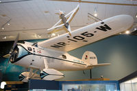 N105W - On display at the National Air and Space Museum. This specially modified Vega set the record in 1931 for the first around the world flight by a fixed-wing aircraft, taking eight days in the hands of Wiley H. Post and Harold Gatty. - by Arjun Sarup