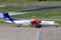 LN-RDD @ EGBB - De Havilland Canada DHC-8Q-402 Dash 8 [4009] (SAS Scandinavian Airlines) Birmingham Int'l~G 18/07/2006 - by Ray Barber