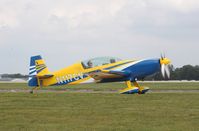 N117CV @ KOSH - Extra EA-300L