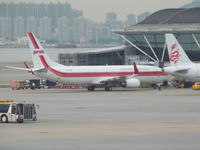 PK-GFN @ VHHH - nice retro scheme - shame a bit fuzzy due to glass - by magnaman