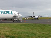ZK-TLL @ NZAA - At AKL awaiting delivery to Toll in Australia.

Has TLL on nosewheel doors.

These 737s are also replacing old F27s in NZ - ZK-POH in background awaiting its fate. - by magnaman