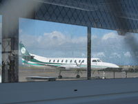 ZK-CID @ NZAA - Taken through wire fence then through window of passenger tunnel at domestic apron! This a/c is ex ZK-NSS - by magnaman