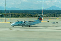 C-FMDW @ CYVR - Taxiing to Domestic after landing on north runway. - by Remi Farvacque