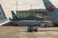 C-GWUX @ CYVR - Parked at International Terminal, shot from another aircraft. - by Remi Farvacque