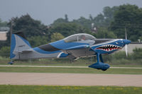 N68TP @ KOSH - Landing - by alanh