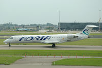 S5-AAY @ EHAM - Bombardier CRJ-701ER of Adria Airways at Schiphol airport, the Netherlands - by Van Propeller