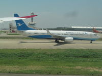 B-5750 @ ZSPD - taxying in as we taxy out past it - by magnaman
