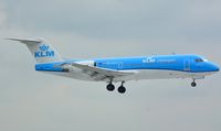 PH-KZU @ EHAM - Fokker 70 seconds from touching down at the Polderbaan - by Paul H