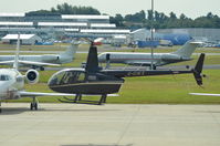 G-CIKX @ EGLF - Robinson R66 Turbine taxking to TAG parking for pax drop off
during Farnborough Air Show - by Syed Rasheed