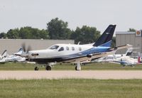 C-FKRR @ KOSH - Socata TBM-700N - by Mark Pasqualino
