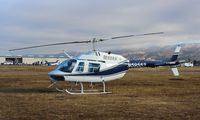 N59553 @ E16 - Sycan Corp (Paso Robles, CA) 1974 Bell 206B parked in the grass at South County Airport, San Martin, CA to help fight the Loma fire. - by Chris Leipelt