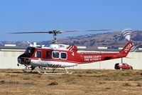 N541FA @ E16 - USDA Forest Service (Irvine, CA) Bell UH-1H preparing for departure at South County Airport, San Martin, CA. - by Chris Leipelt