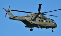 ZJ994 @ EGHH - Royal Navy Merlin on finals to 08 - by John Coates
