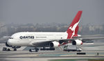VH-OQI @ KLAX - Getting towed to parking at LAX - by Todd Royer