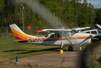 CF-CCX @ CYYE - Parked northeastern-most end of airfield.