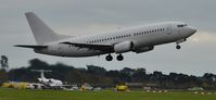 9H-AJW @ EGHH - Departing past Emb G-CHMR - by John Coates