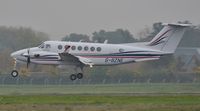 G-BZNE @ EGHH - Arriving through the mist - by John Coates