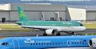 EI-CVA @ EGAC - Arriving from Heathrow and KLM PH-KZD awaiting departure to Amsterdam.