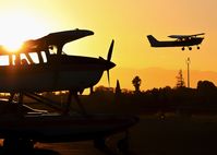N9493Z @ KRHV - Locally-based 1981 Cessna T206G on floats with Cessna 172 departing in background at Reid Hillview Airport, San Jose, CA. - by Chris Leipelt