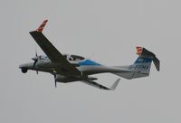 G-FFMV @ EGHH - Departing in the rain - by John Coates
