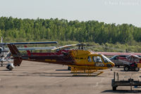 C-FYYA @ CYYE - Parked in front of Highland Helicopters hangar. - by Remi Farvacque