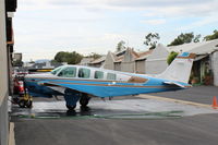 N6728Z @ SZP - 1980 Beech A36TC BONANZA, Continental TSIO-520-UB 300 Hp, 3 blade prop, 6 seats, washing the aircraft - by Doug Robertson