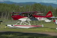 C-FLKK @ CYYD - Parked at east end of airport with other private craft. - by Remi Farvacque