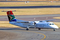 ZS-NLX @ FAJS - De Havilland Canada DHC-8-315 Dash 8 [348] (South African Express) Johannesburg Int'l~ZS 19/09/2006. Taken through the glass of the terminal.