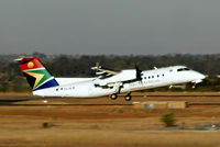 ZS-NLW @ FAJS - De Havilland Canada DHC-8-311 Dash 8 [338] (South African Express) Johannesburg Int~ZS 22/09/2006.  Taken through the glass of the terminal.