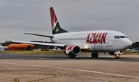 5N-AIS @ EGHH - Taxiing to depart on delivery - by John Coates