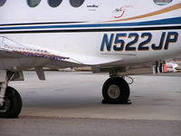 N522JP @ KBOI - Flares off the wing and equipment on the bottom of the aircraft for seeding the clouds to make rain/snow