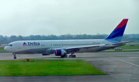 N194DN @ EGBB - Boeing 767-332ER [28451] (Delta Air Lines) Manchester-Ringway~G 14/12/2004 Former colour scheme. Has a slight bit of backlight from the terminal window.
