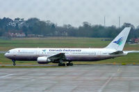 G-OBYF @ EGBB - Boeing 767-767-304ER [28208] (Garuda Indonesia) Birmingham Int'l~G 25/02/2005. Some markings on the glass of the terminal window.