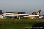 9V-SWK @ EGCC - Singapore Airlines - by Chris Hall