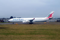 4R-ADE @ LHR - Seen at London Heathrow from departing aircraft - by Neil Henry