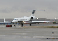 C-GNDN @ KBOI - Turning off RWY 28R. Very wet morning. - by Gerald Howard