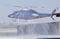 N686LF @ KBOI - Kicking up a little snow on landing.