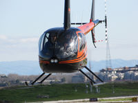 N447S @ KSQL - San Carlos Flight Center 2005 Robinson in head-on hover @ San Carlos Airport, CA - by Steve Nation