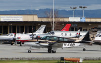 N142DA @ KSQL - HJ + L Air LLC (Sacramento, CA) operates this very sharp 1985 Beech 58 seen taxiing to transient ramp @ San Carlos Airport, CA - by Steve Nation