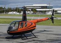 N447S @ KSQL - San Carlos Flight Center 2005 Robinson R44 between training flights @ San Carlos Airport, CA - by Steve Nation