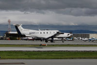 N816SA @ KSQL - Surf Air 2014 Pilatus PC-12/47E over the threshold @ San Carlos Airport, CA - by Steve Nation