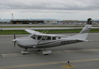 N92977 @ KSQL - Locally-based 2011 Cessna T206H Stationair taxiing for take-off before the rains came @ San Carlos Airport, CA - by Steve Nation