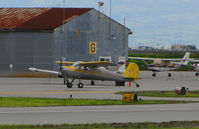 N89458 @ KSQL - Locally-based 1946 Cessna 140 taxiing in on rainy morning @ San Carlos Airport, CA - by Steve Nation