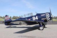 N694US @ KAUN - 1947 North American SNJ-4 parked on the ramp at Auburn Municipal Airport for a brunch run. - by Chris Leipelt